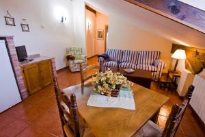 a living room with a table and a couch at Vivienda Casa Luisa in Comillas