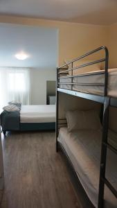 Postel nebo postele na pokoji v ubytování OITUZ Boutique Residence