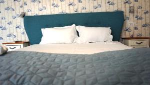 Postel nebo postele na pokoji v ubytování OITUZ Boutique Residence