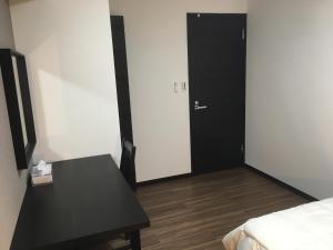Postel nebo postele na pokoji v ubytování TIMES INN 3F