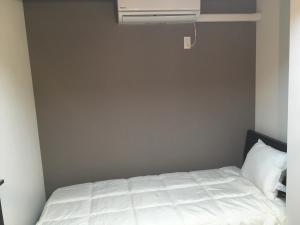 Postel nebo postele na pokoji v ubytování TIMES INN 3F