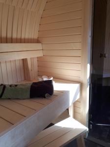 a sauna with a bench in a room at Tinyhouse Zollernalb in Balingen