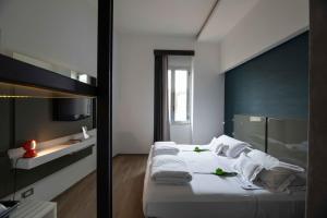 Postel nebo postele na pokoji v ubytování UNA HOTELS One Siracusa