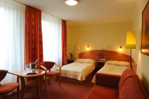 Posteľ alebo postele v izbe v ubytovaní Hotel Gorzów