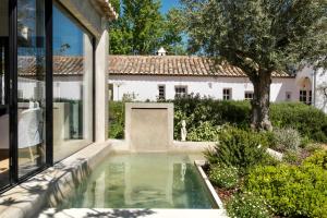 a swimming pool in the backyard of a house at Quinta da Lua in Tavira