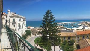 a view from a balcony of a city with a tree at Residence Ducale in Rodi Garganico