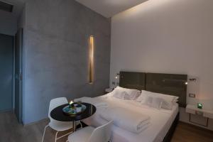 Postel nebo postele na pokoji v ubytování UNA HOTELS One Siracusa