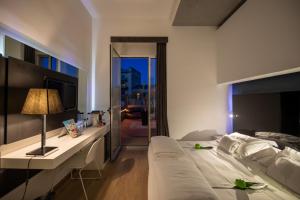 Postel nebo postele na pokoji v ubytování UNA HOTELS One Siracusa + 37 fotografií