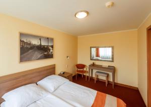 Posteľ alebo postele v izbe v ubytovaní Hotel Gorzów