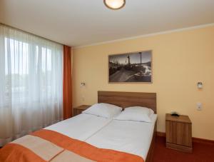 Posteľ alebo postele v izbe v ubytovaní Hotel Gorzów