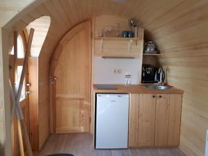 a kitchen in a tiny house with a sink at Tinyhouse Zollernalb in Balingen