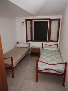 Cama o camas de una habitación en Seguimi a Calasetta