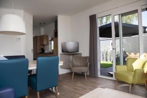 Posezení v ubytování 6 pers. Veluwelodge XL met Sauna