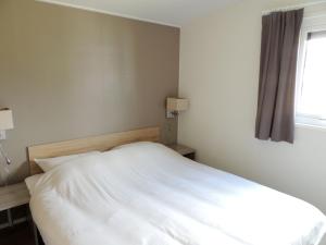 Postel nebo postele na pokoji v ubytování 6 pers. Veluwelodge XL met Sauna