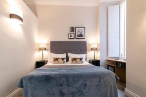 Postel nebo postele na pokoji v ubytování Eccelso Hotel