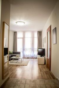 Televízia a/alebo spoločenská miestnosť v ubytovaní Don Quijote Apartment