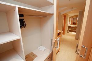 a walk in pantry with two white shoes in it at Hotel Aqua in Marmaris