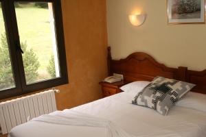Postel nebo postele na pokoji v ubytování Hotel Sucara