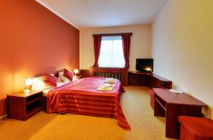 Postel nebo postele na pokoji v ubytování Hotel Stara Posta
