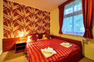 Postel nebo postele na pokoji v ubytování Hotel Stara Posta