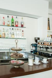 a kitchen with a counter with a bowl of food at Hotel Houston in Rimini