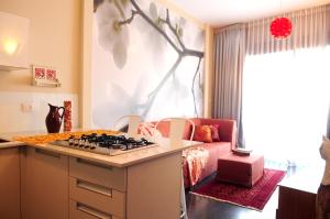 a kitchen with a stove top in a room at King George Apartments in Tel Aviv