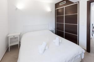 Postel nebo postele na pokoji v ubytování Sea Pearl