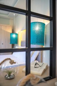 A bed or beds in a room at Fata Morgana Studios & Apartments