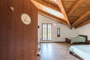 Postel nebo postele na pokoji v ubytování B&B La Mortella