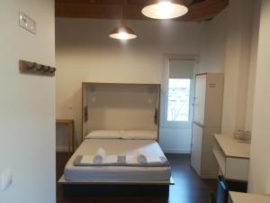 A bed or beds in a room at Agora Hostel