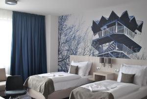 Postel nebo postele na pokoji v ubytování Košice Hotel