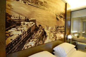 a hotel room with a picture of a city at Harbour Grand Hong Kong in Hong Kong