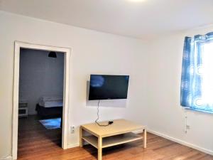 En TV eller et underholdningssystem på AVI City Apartments MainHouse