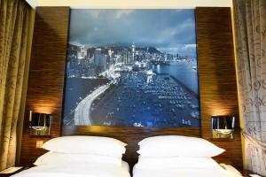 Uma cama ou camas num quarto em Harbour Grand Hong Kong