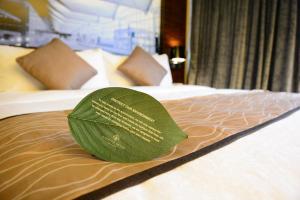 Uma cama ou camas num quarto em Harbour Grand Hong Kong
