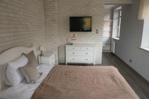 Posteľ alebo postele v izbe v ubytovaní Apartamenty Faust