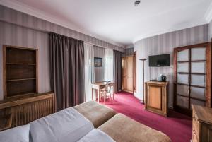 Кровать или кровати в номере Hotel Kopala