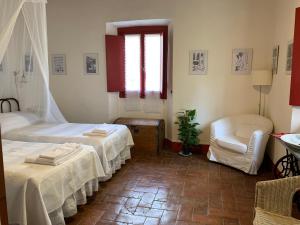 Postel nebo postele na pokoji v ubytování Il Paretaio