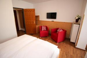 Postel nebo postele na pokoji v ubytování Hotel Heigl