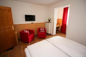 Postel nebo postele na pokoji v ubytování Hotel Heigl