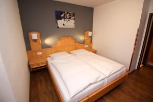 Postel nebo postele na pokoji v ubytování Hotel Heigl