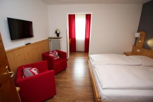 Postel nebo postele na pokoji v ubytování Hotel Heigl