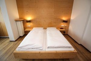 Postel nebo postele na pokoji v ubytování Hotel Heigl