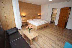 Postel nebo postele na pokoji v ubytování Hotel Heigl