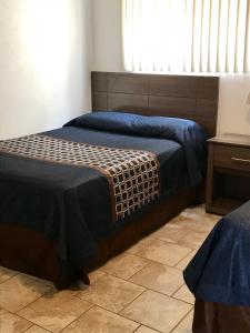 Ένα ή περισσότερα κρεβάτια σε δωμάτιο στο North Wind Motel