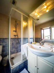 a bathroom with a sink and a shower at Achafla Baita in Ascain