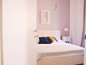 Ένα ή περισσότερα κρεβάτια σε δωμάτιο στο Blu Home - Bilocale in centro