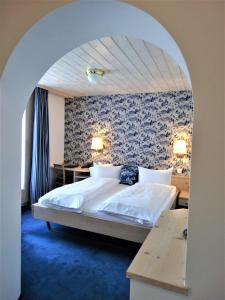 Postel nebo postele na pokoji v ubytování Hotel Bündnerhof