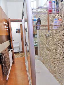 a bathroom with a shower with a glass door at Piana degli Ulivi a Lerici in Lerici