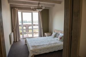 Posteľ alebo postele v izbe v ubytovaní Apartamenty Faust + 37 fotografií